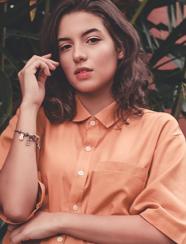 model wearing coral shirt - desktop image